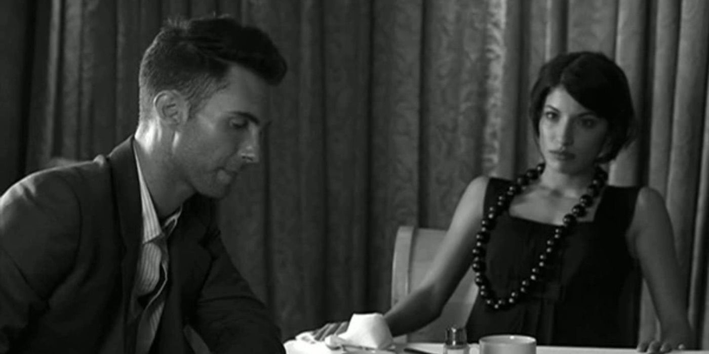 Tania Raymonde looks sternly at Adam Levine in the "Won't Go Home Without You" music video