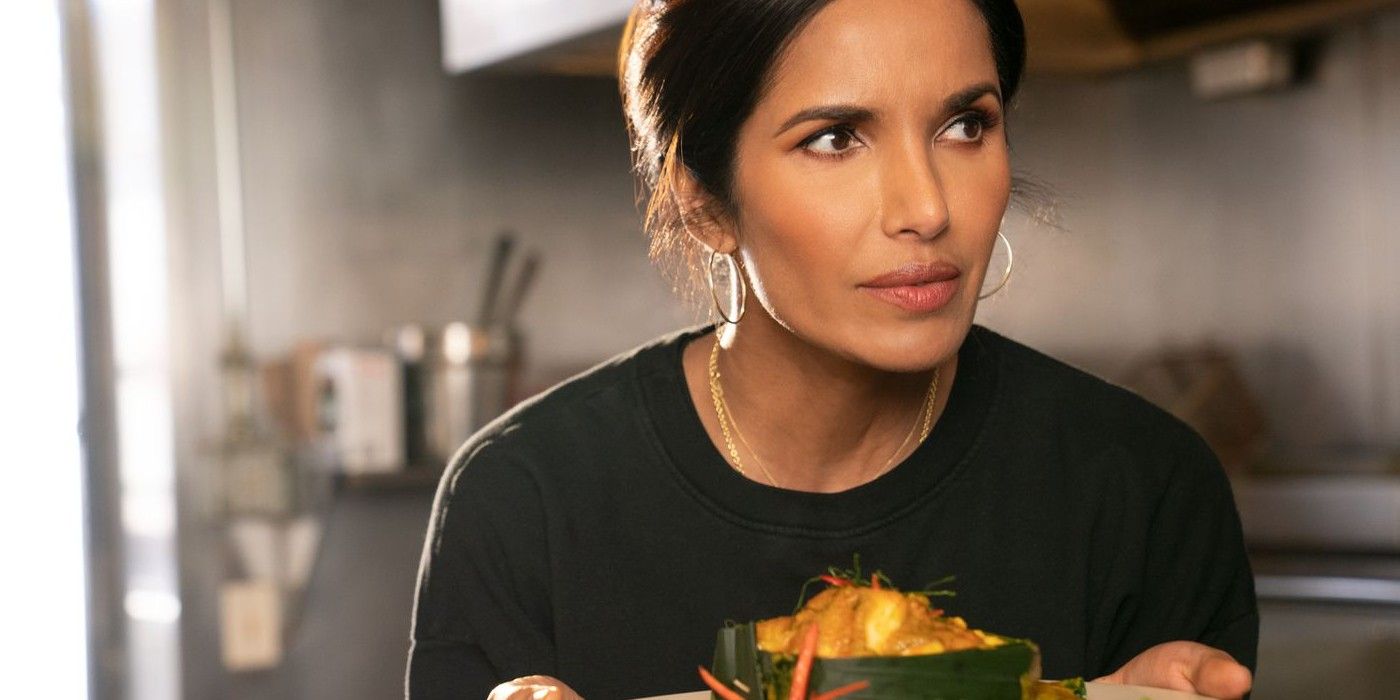 Padma Lakshmi holding a dish of food in Taste the Nation