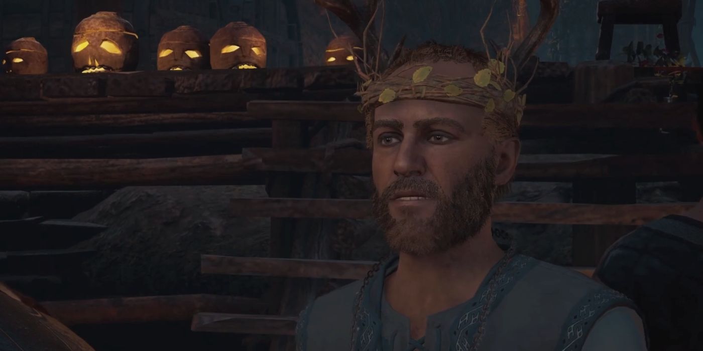 A close-up of Tewdwr in Assassin's Creed Valhalla, wearing a crown made of twigs and leaves.