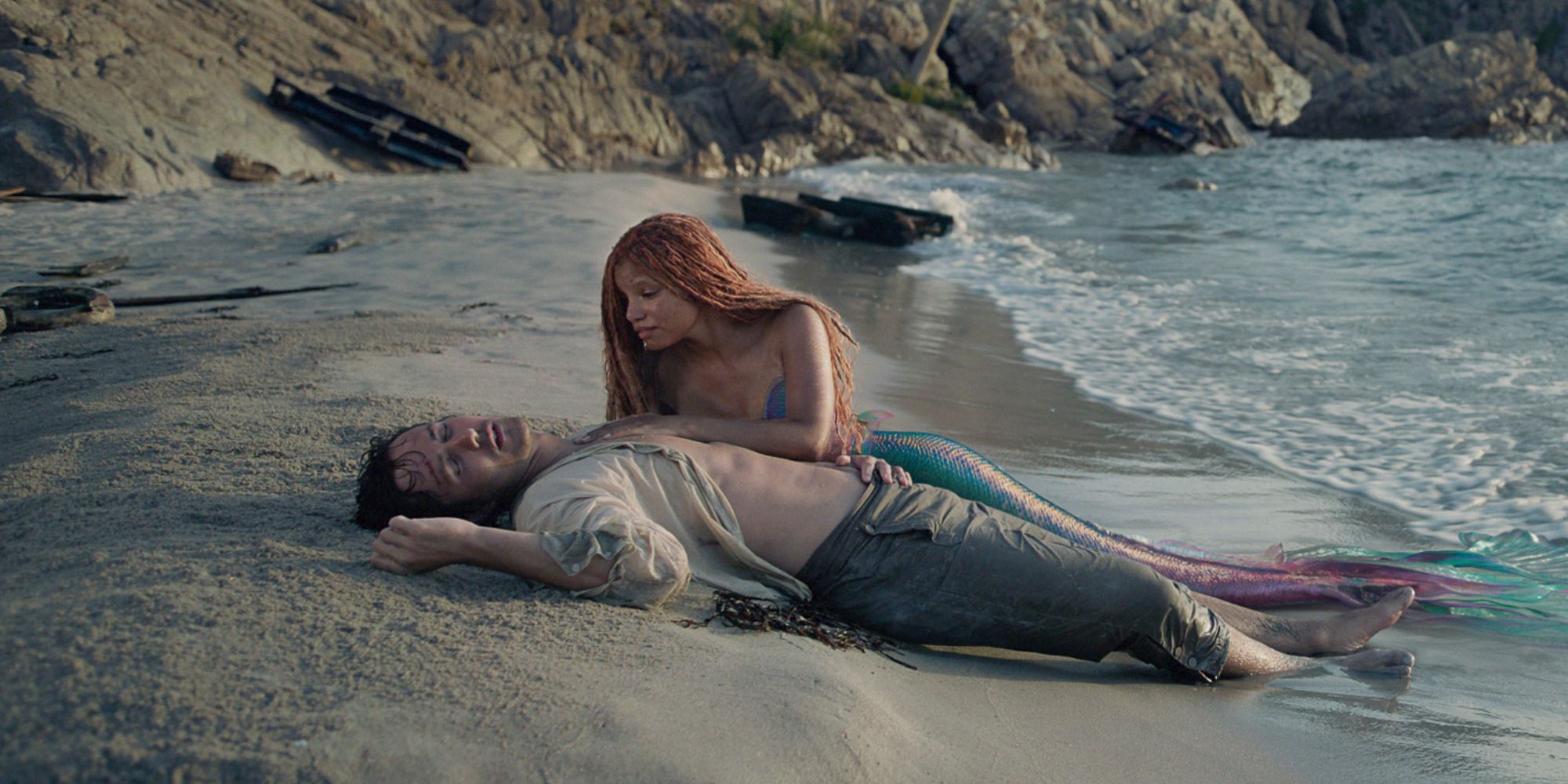 The Little Mermaid Ariel and Prince Eric washed up on the beach