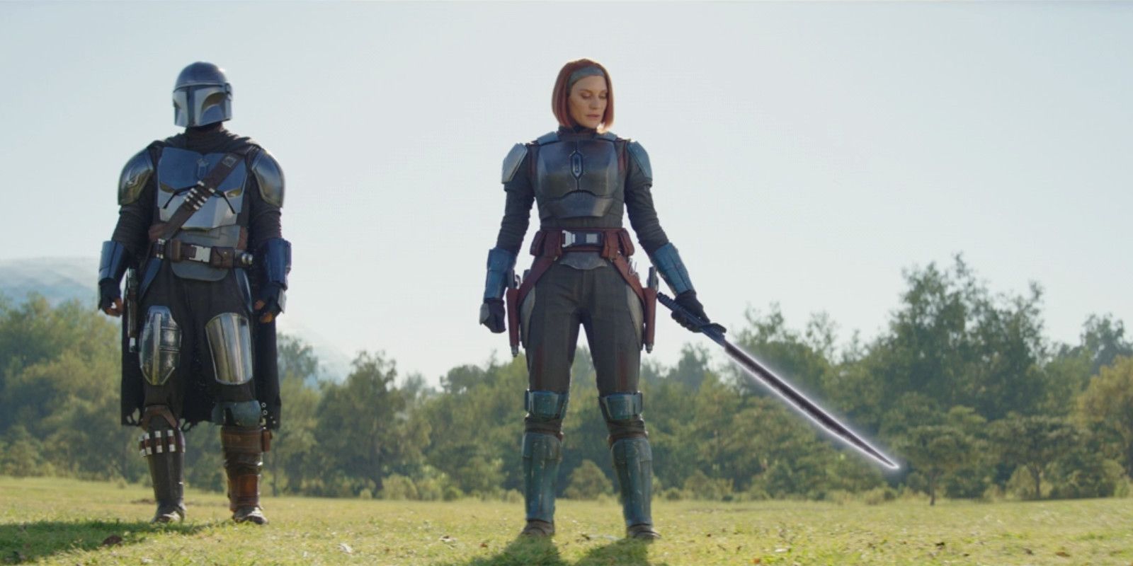 Din Djarin and Bo-Katan with the Darksaber in The Mandalorian season 3, episode 6.