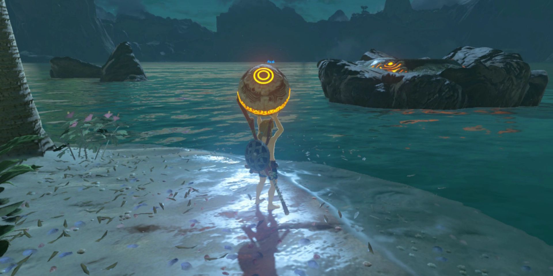 Link holds a glowing orange orb over his head during the Eventide Island survival challenge in Breath of the Wild