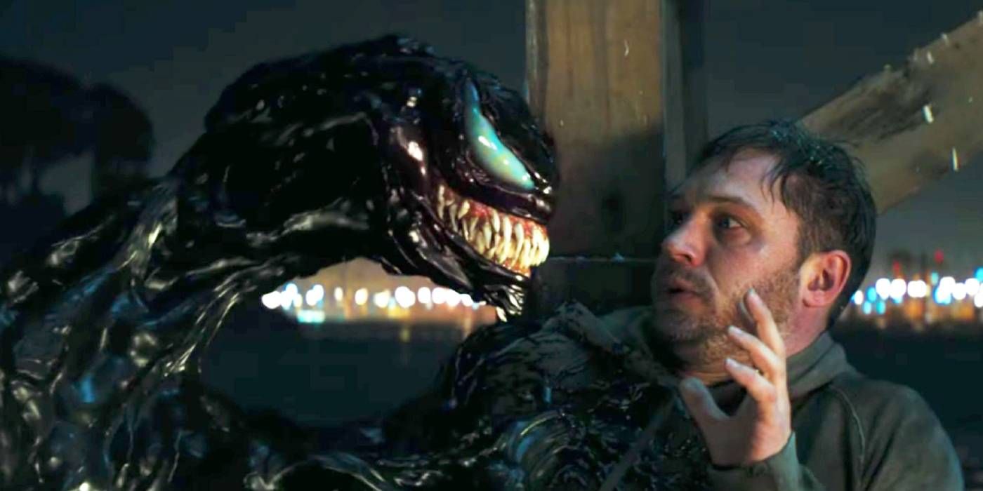 Eddie looks scared by Venom in the 2018 film.