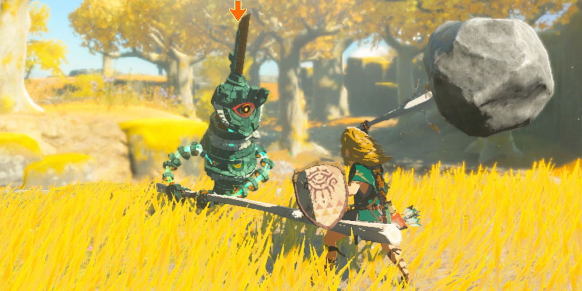 Link swings a rock-tipped sword at a mechanical enemy in a grassy field in The Legend of Zelda: Tears of the Kingdom.