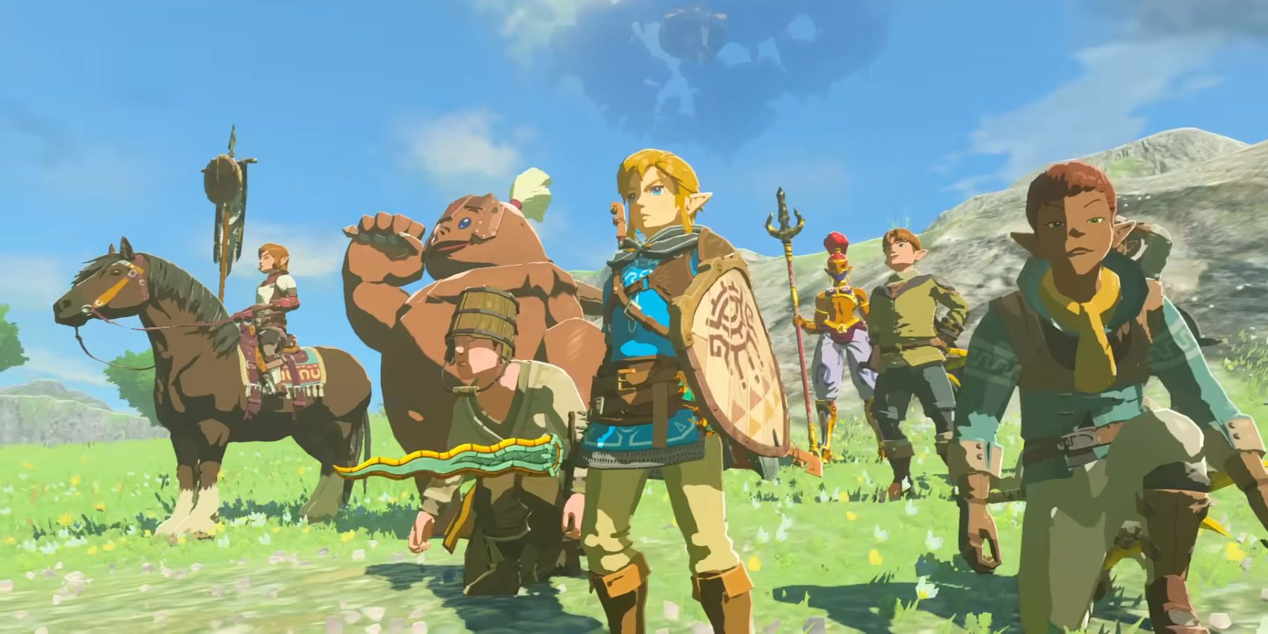 Link and a group of NPCs gathered on a hill side in Tears of the Kingdom.