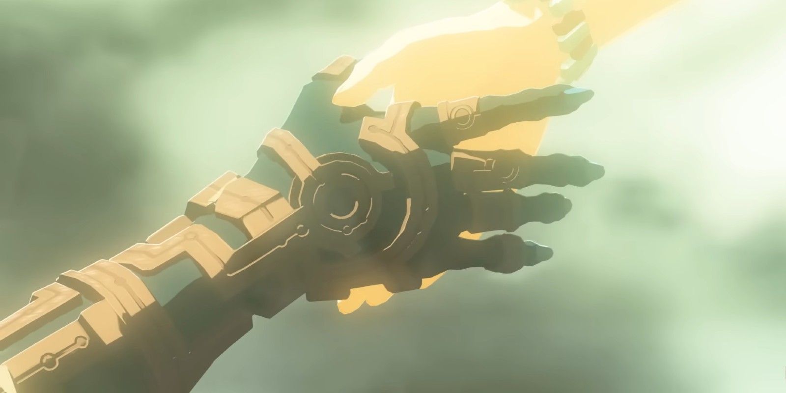 Zonai and Hylian hands reach out towards each other in The Legend of Zelda: Tears of the Kingdom.