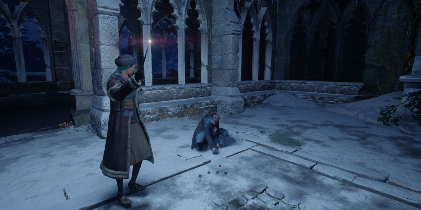 Zenobia crouched on the ground playing Gobstones by herself in Hogwarts Legacy.