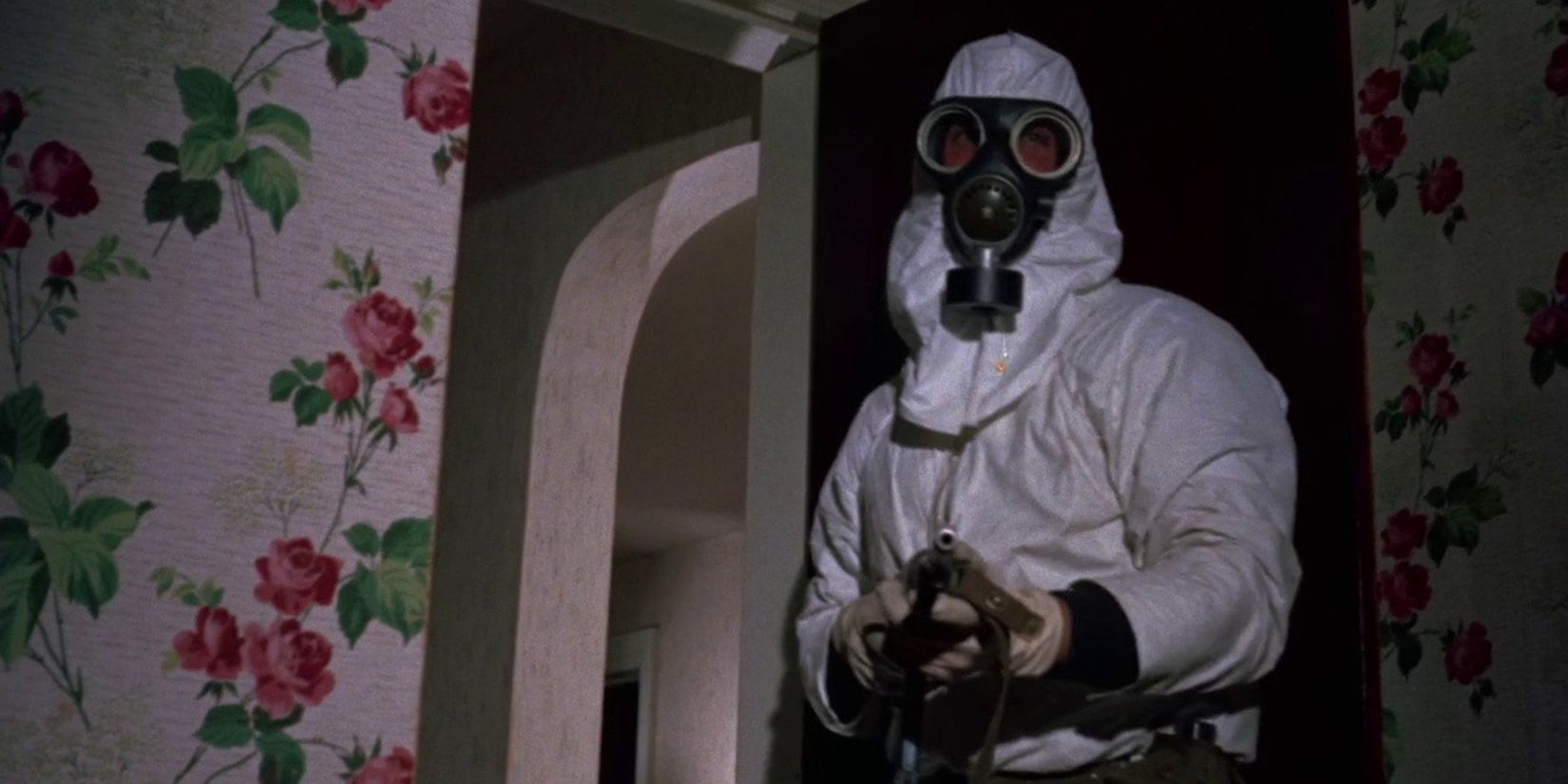 A scientist in a hazmat suit with a gun in The Crazies