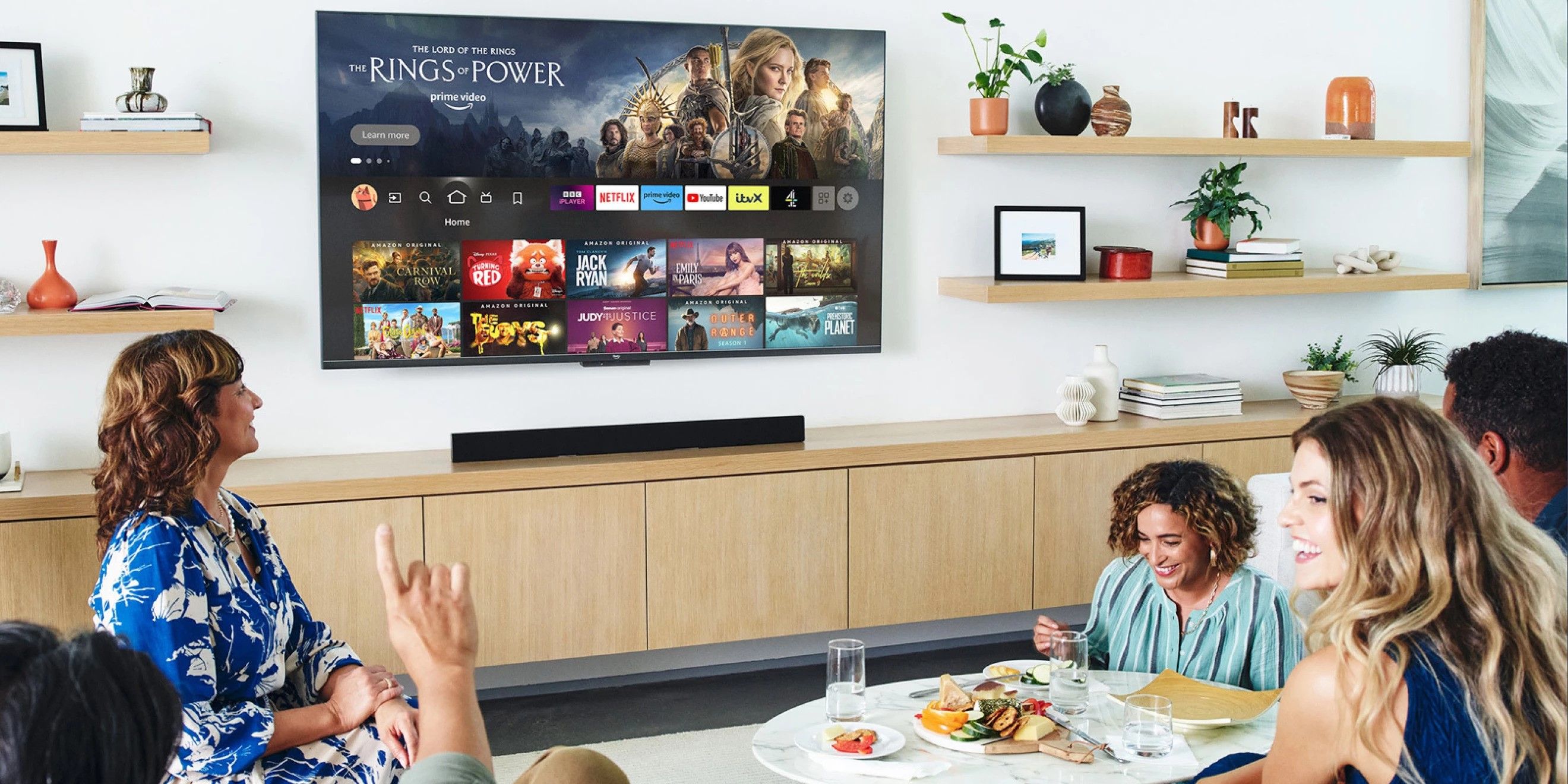 Image showing a family sitting around an Amazon Fire TV 4K smart TV