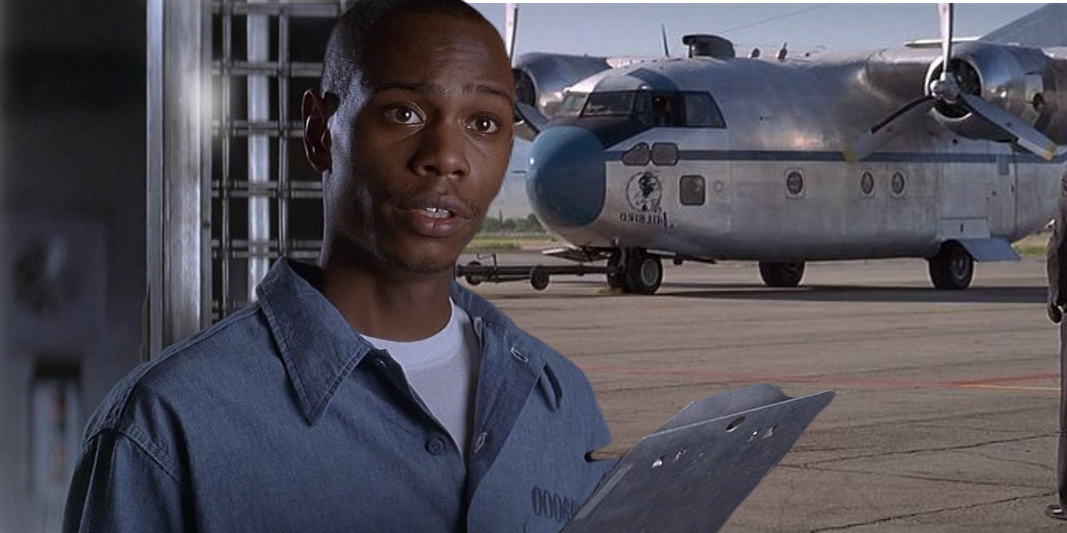 An image of Dave Chappelle standing with a clipboard in front of a plane in Con Air