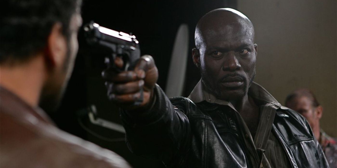 An image of Eriq Ebouaney holding a gun in The Horde