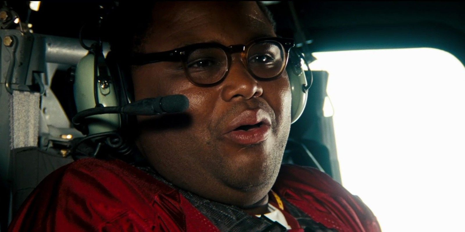 Anthony Anderson wearing a headset in a helicopter in Transformers