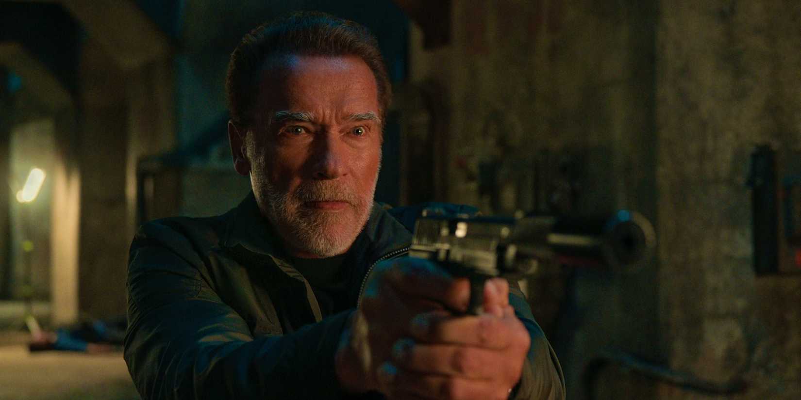 Luke points a gun at someone offscreen in FUBAR