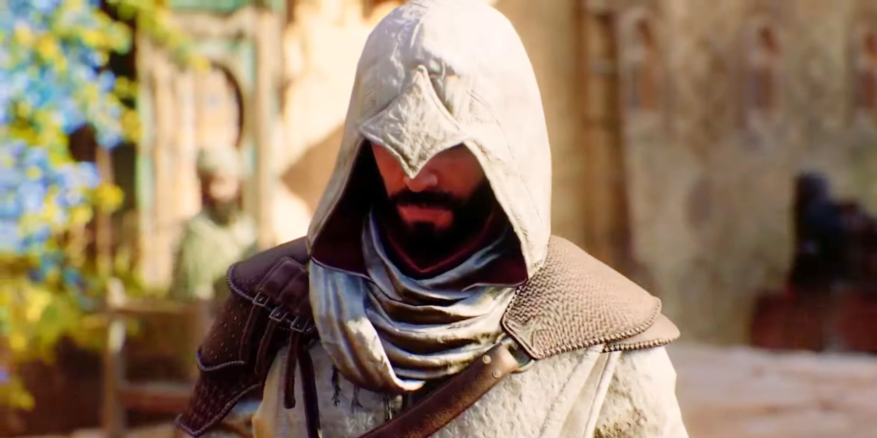 A close-up of Basim in Assassin's Creed Mirage, with a white Assassin hood pulled over his eyes.