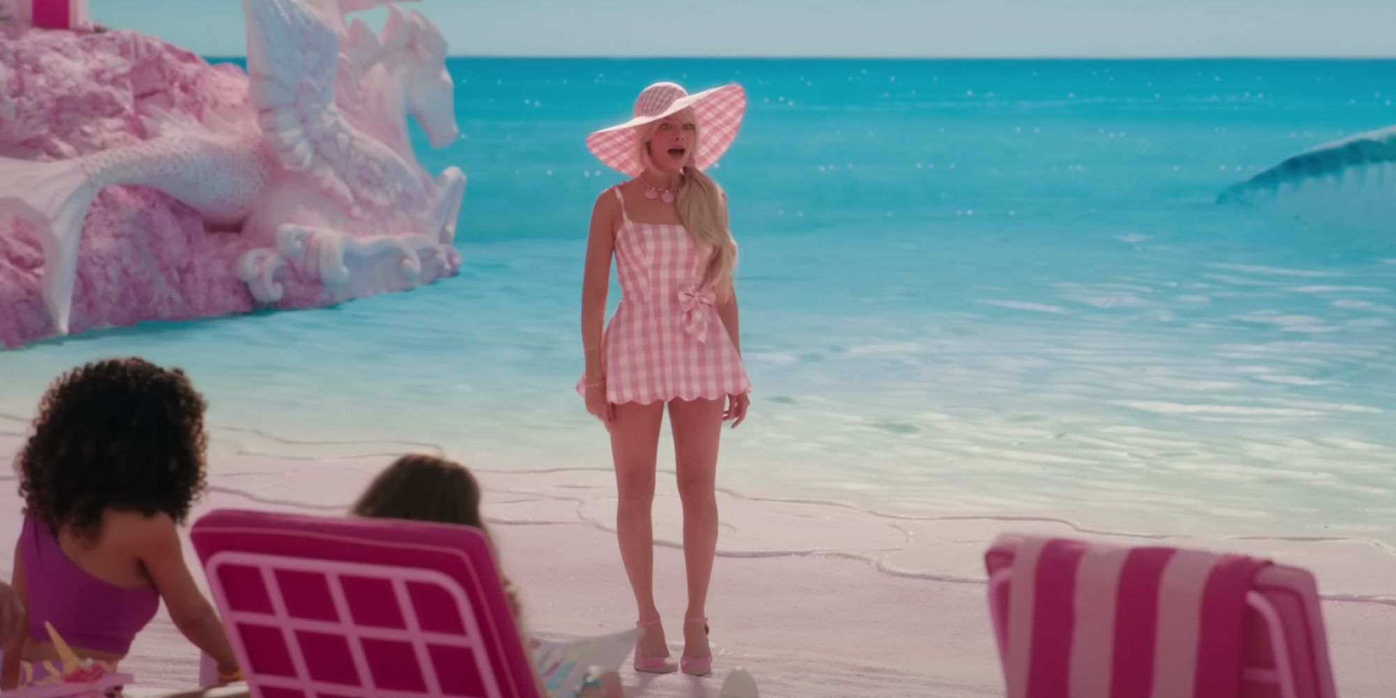 Barbie standing on the beach in a plaid dress
