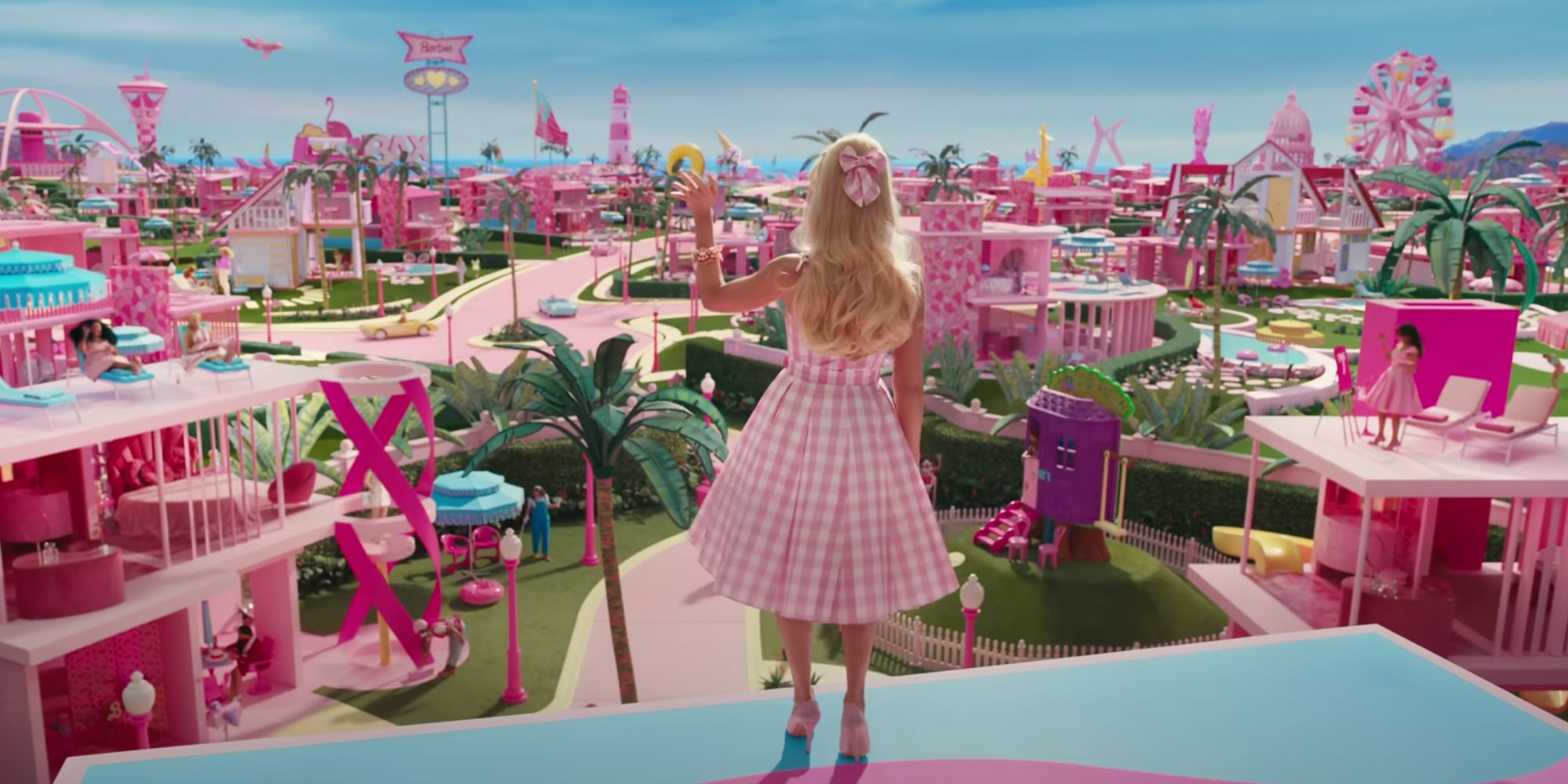 Barbie looking out over Barbieland in a pink plaid dress