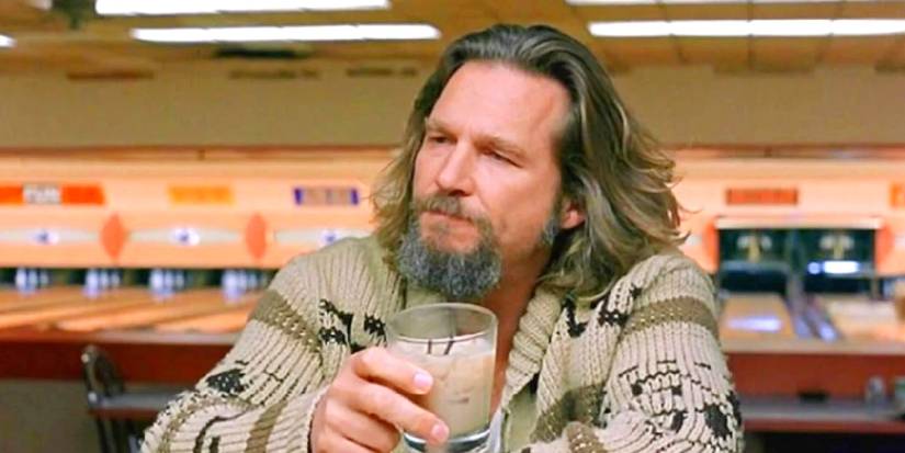 Jeff Bridges as The Dude drinking a white russian at the bowling alley bar in The Big Lebowski.