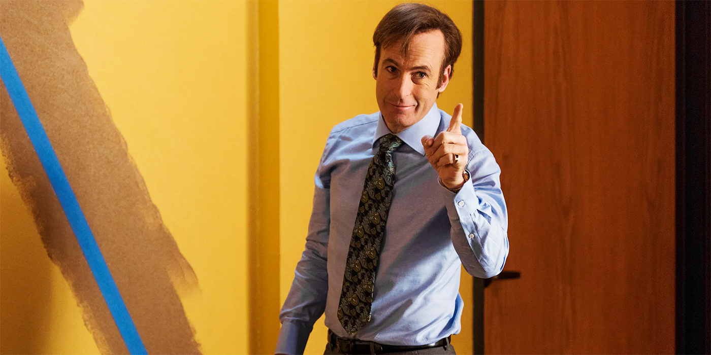 Bob Odenkirk as Saul Goodman in front of wall he's painting