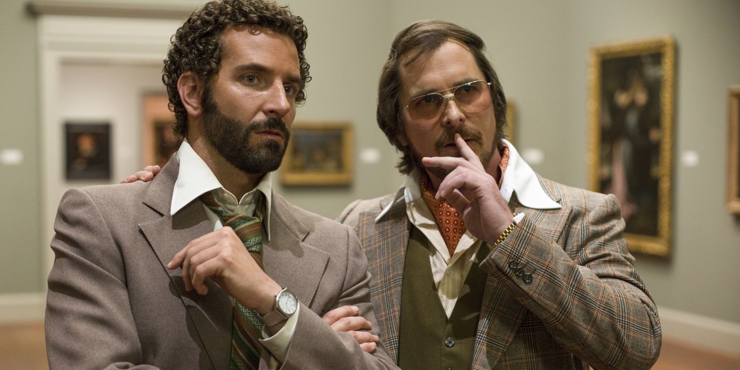 Bradley Cooper and Christian Bale in an art gallery in American Hustle