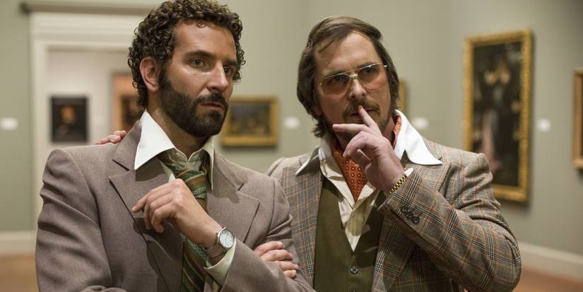 Bradley Cooper and Christian Bale in an art gallery in American Hustle