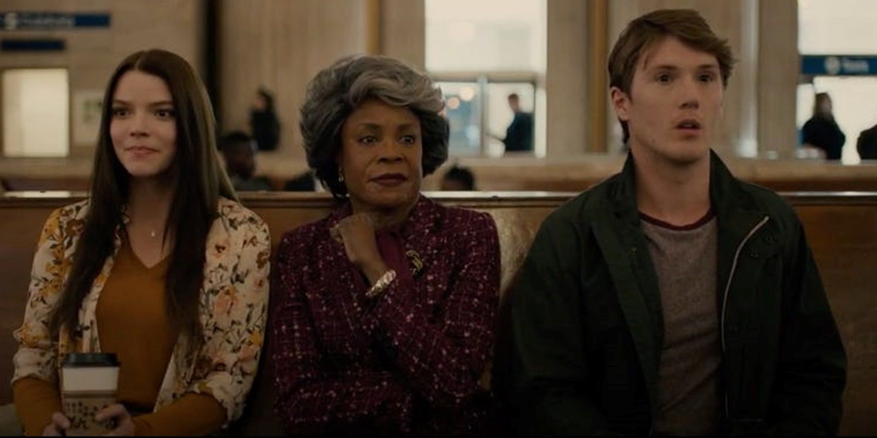 Casey, Mrs Price, and Joseph in a train station in Glass