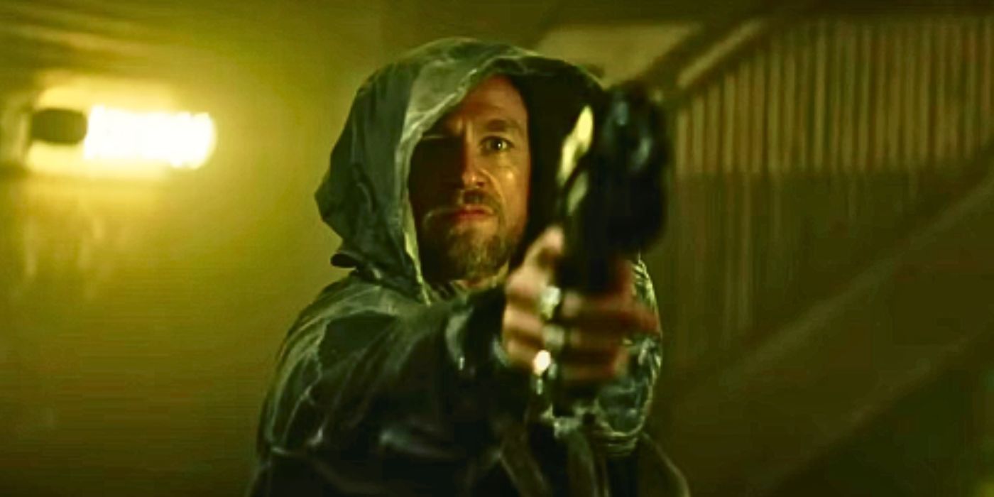 Charlie Hunnam pointing a gun in Rebel Moon