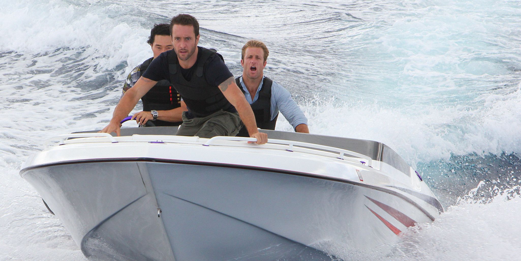 Chin, Steve, and Danny on a speedboat in Hawaii Five-0