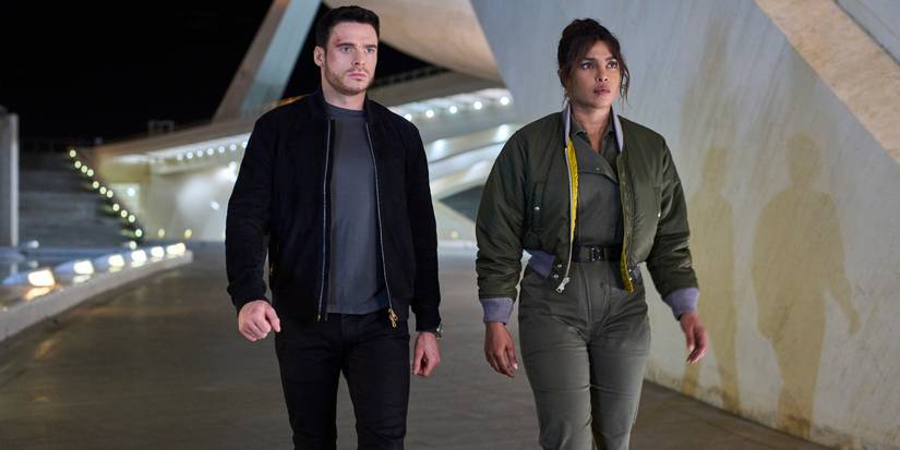 Nadia and Mason walk on a lighted path together in Citadel