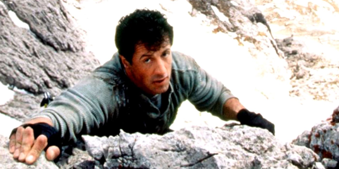 Sylvester Stallone scaling a mountain as Gabe Walker in Cliffhanger