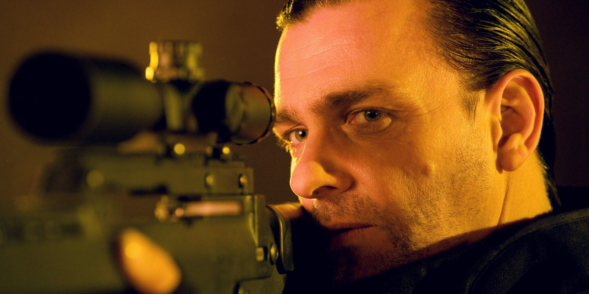 Close up of Ray Stevenson as Frank Castille in Punisher War Zone aiming down sights