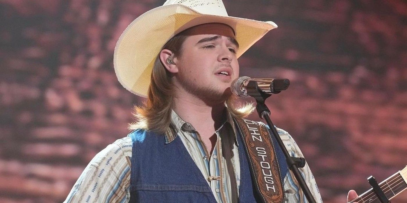 Colin Stough Performing On American Idol with cowboy hat and guitar