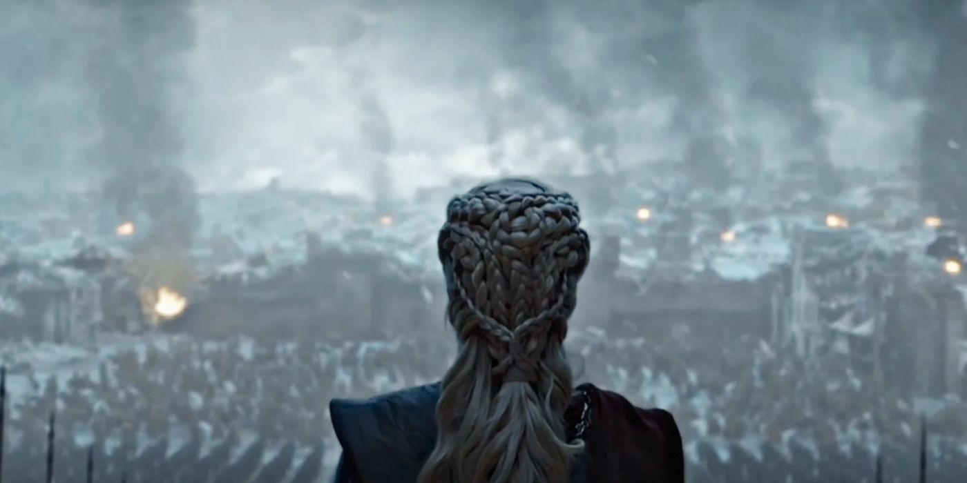 Emilia Clarke as Daenerys Targaryen looks at King's Landing burning in Game of Thrones