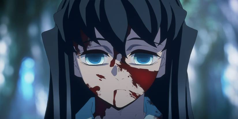 Demon Slayer's Mist Hashira, Tokito, looking traumatized with blood spatter on his face.