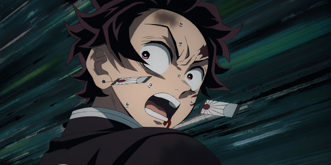 Demon Slayer's Tanjiro looking back with fearful surprise. 
