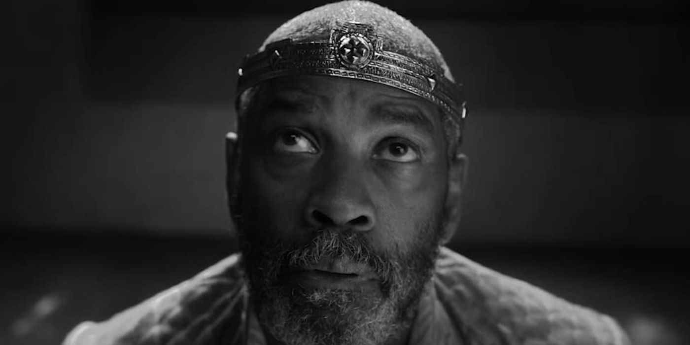 Macbeth (Denzel Washington) looking upwards at the witches in The Tragedy of Macbeth