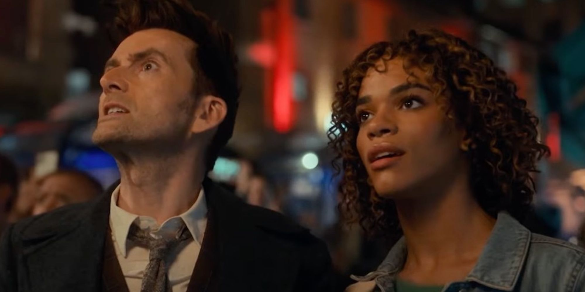 David Tennant as the Fourteenth Doctor and Yasmin Finney as Rose looking at something in Doctor Who 60th Anniversary