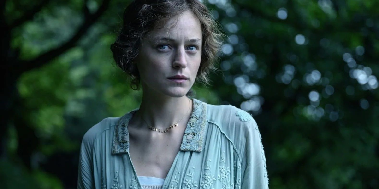 Emma Corrin in the woods in Lady Chatterley's Lover