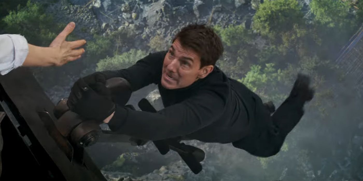 Ethan hanging off train in Mission: Impossible — Dead Reckoning Part One