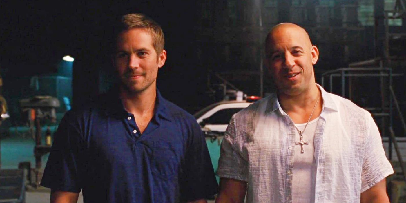 Brian and Dom grin at the vault full of money in Fast Five