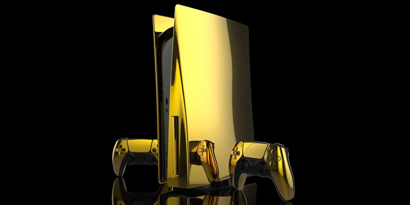 Gold plated PS5 and controllers on a black background