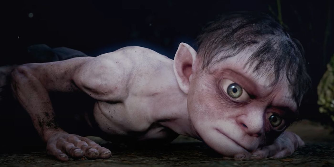 Gollum laying on the ground, looking solemn.