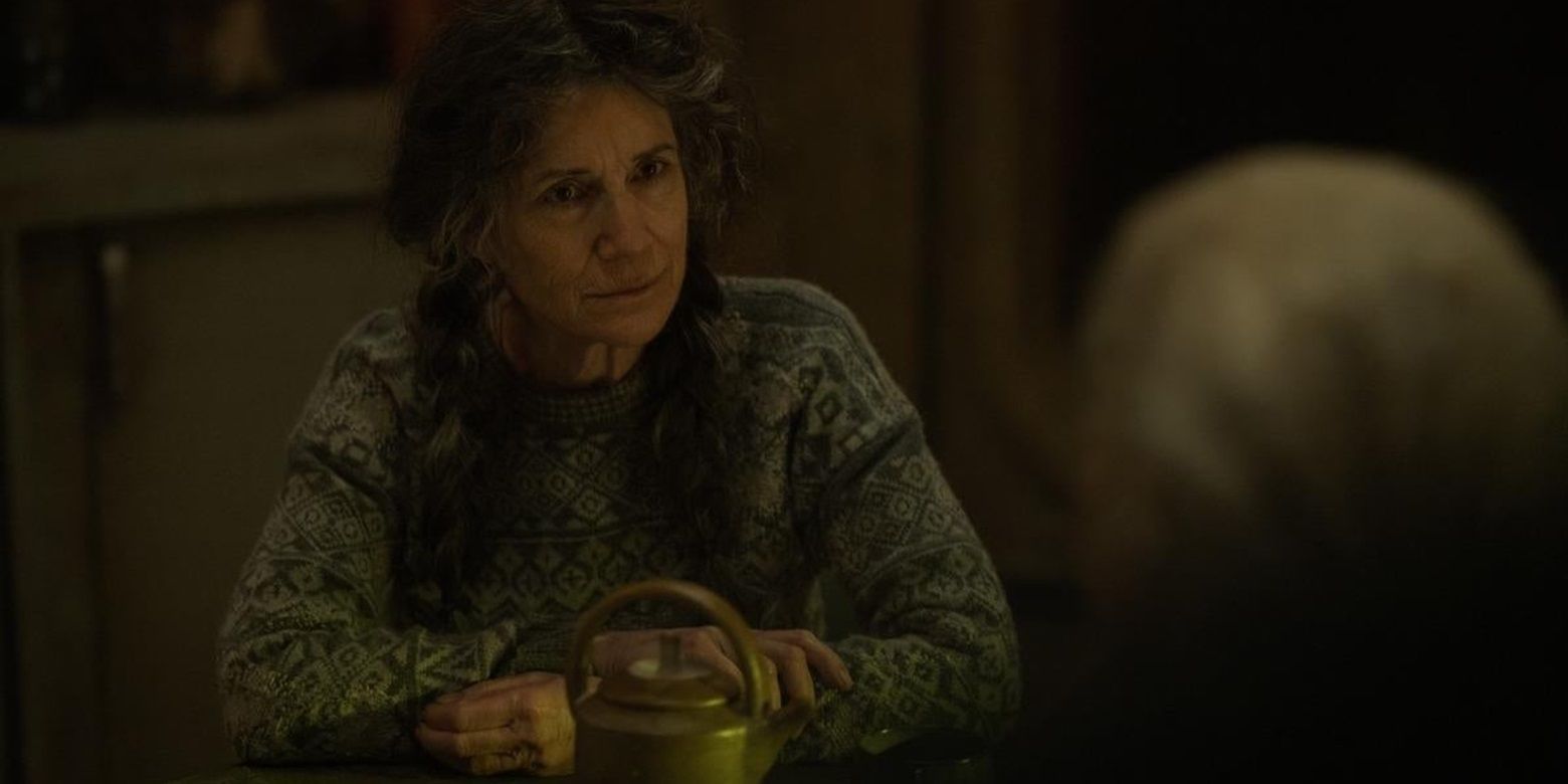 Harriet Walter sitting at a table in Silo