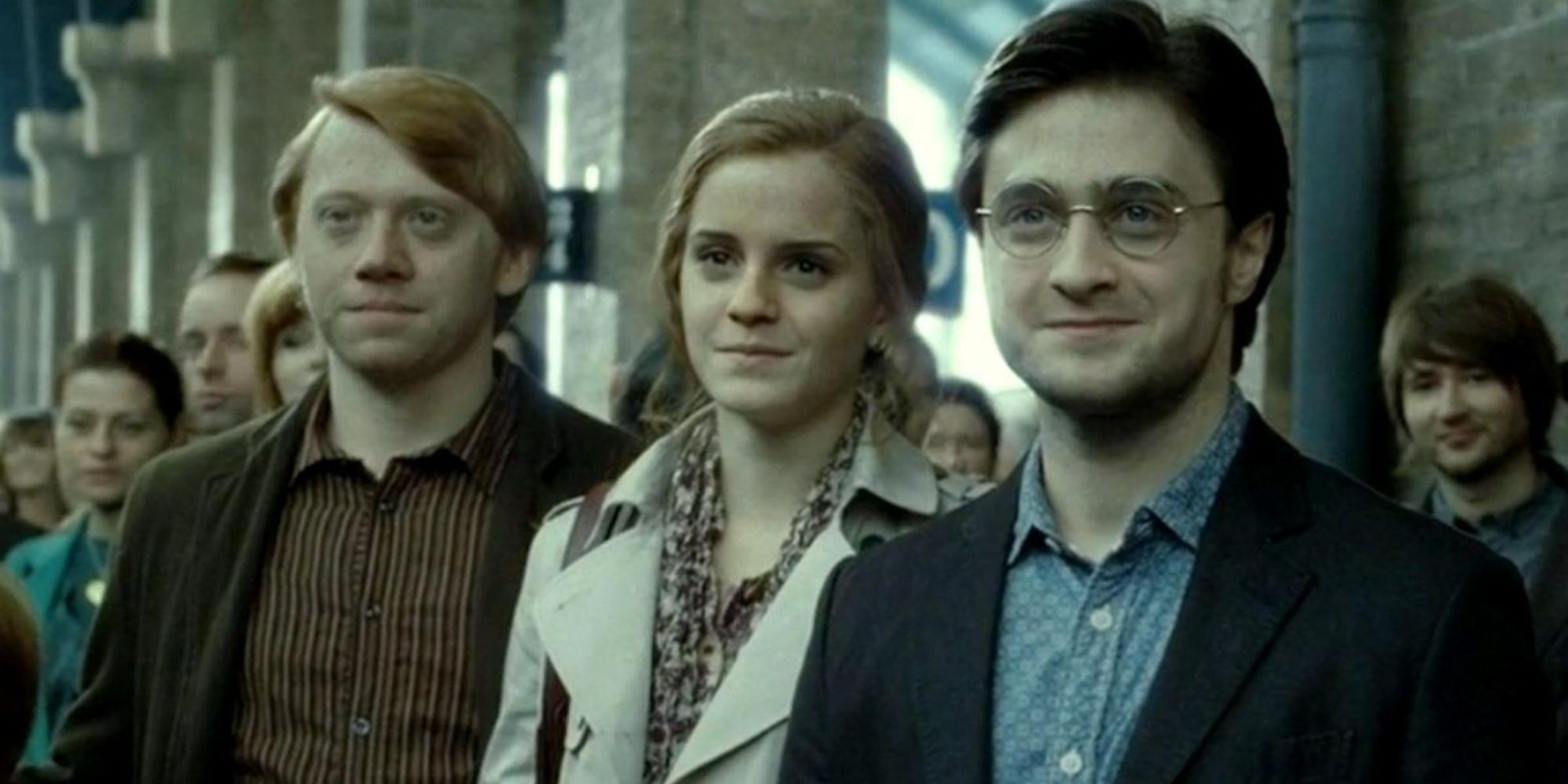 Harry Potter (Daniel Radcliffe), Hermione Granger (Emma Watson), and Ron Weasley (Rupert Grint) seeing their children off in Harry Potter and the Deathly Hallows: Part 2's Epilogue