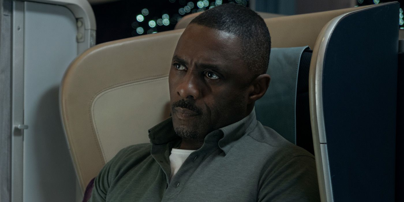Idris Elba in Hijack sitting in an airline seat looking slightly intense