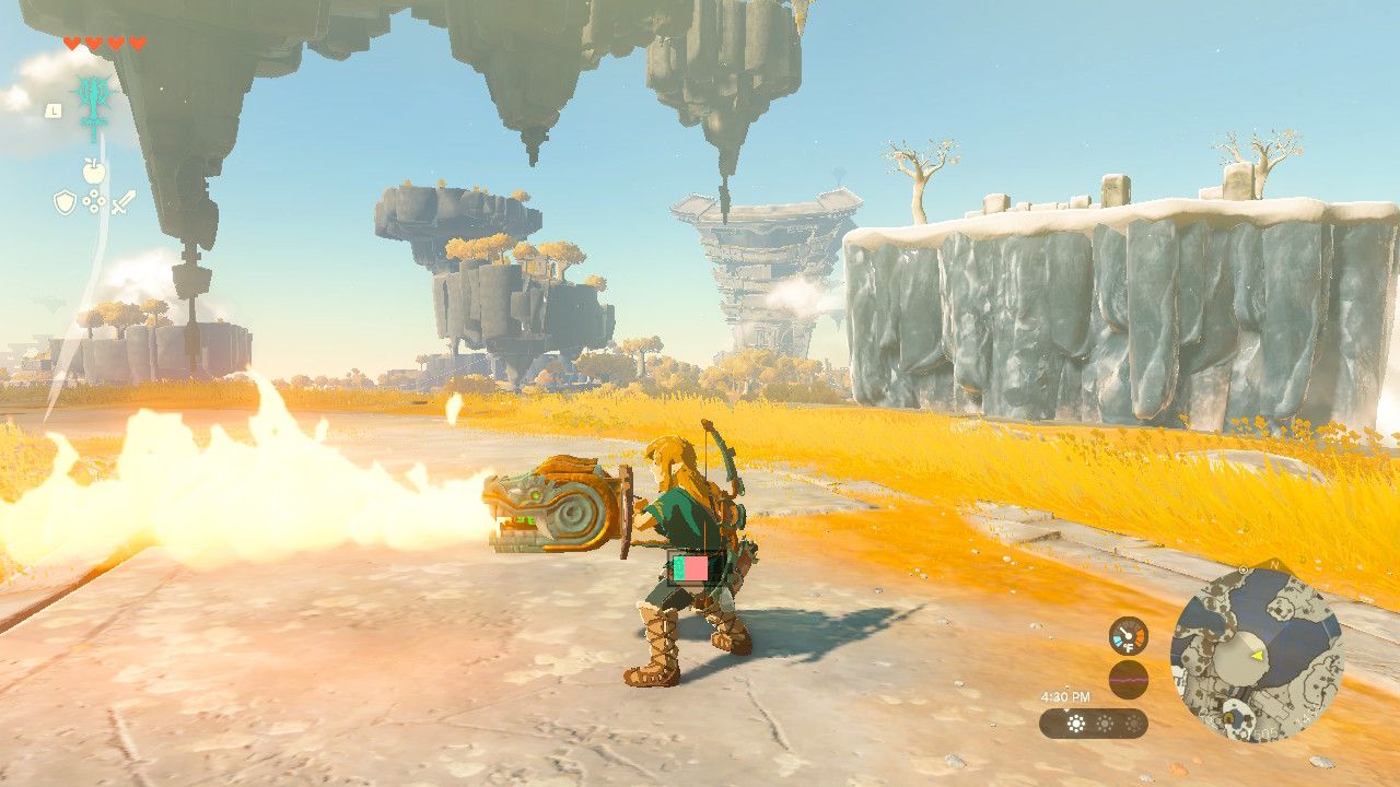 Link holding a flame emitter shield that is shooting fire
