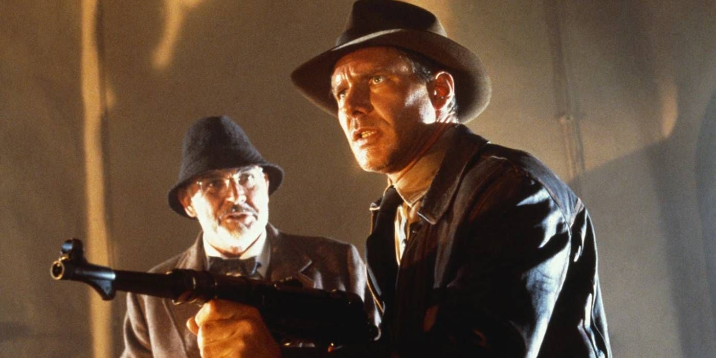 Indiana Jones holding a gun with his father in the Last Crusade
