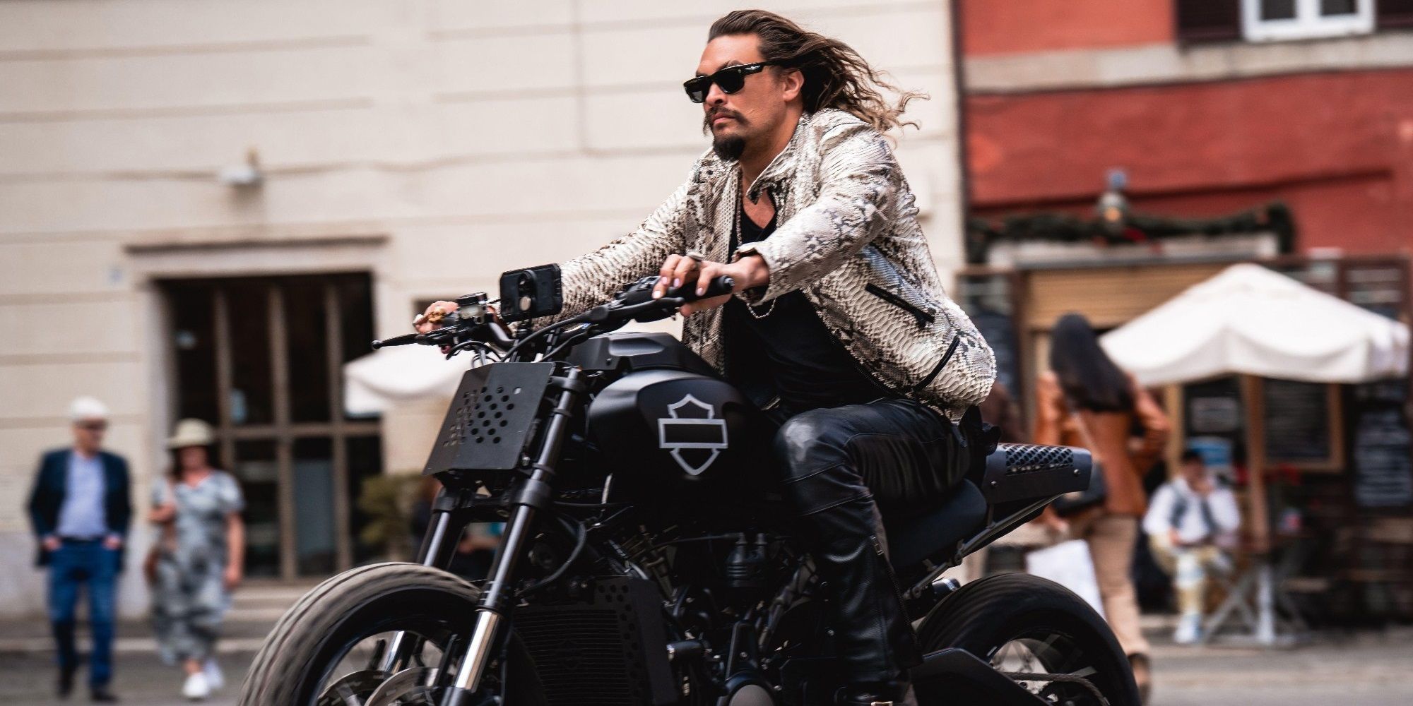 Jason Momoa riding a motorcycle in Fast X