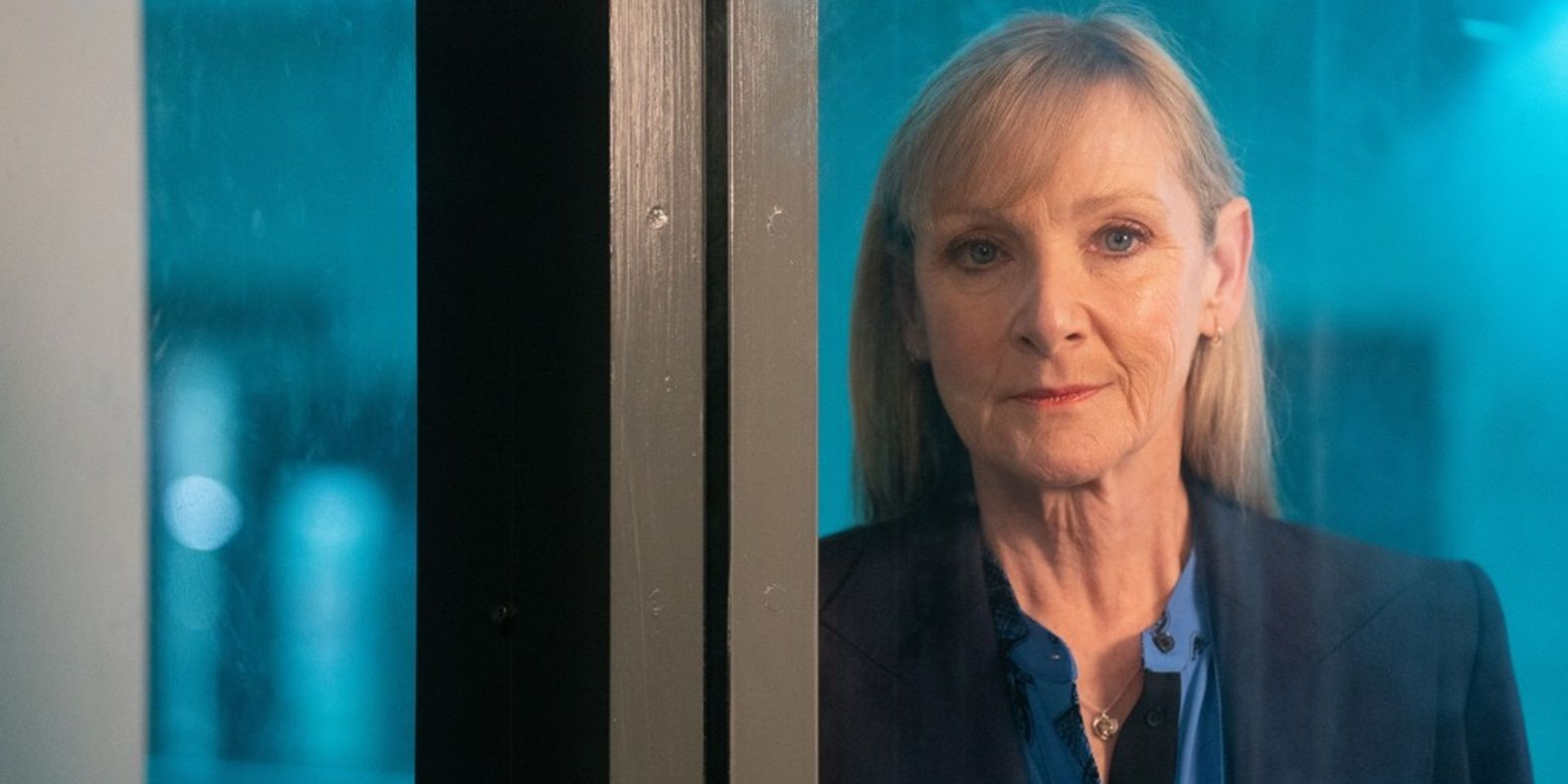 Jean standing in a window in The Full Monty series