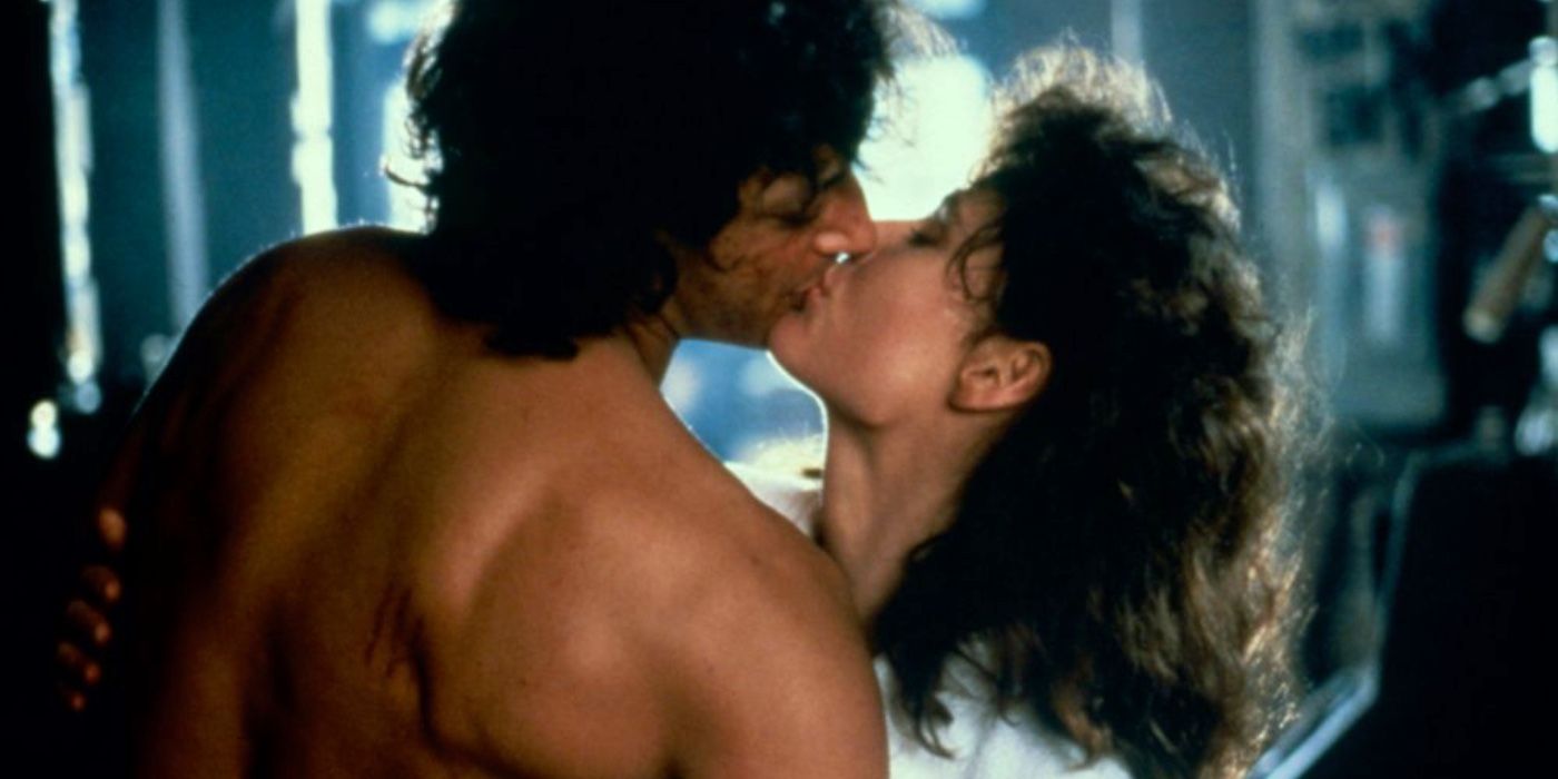Jeff Goldblum and Geena Davis as Seth and Veronica kissing in The Fly.
