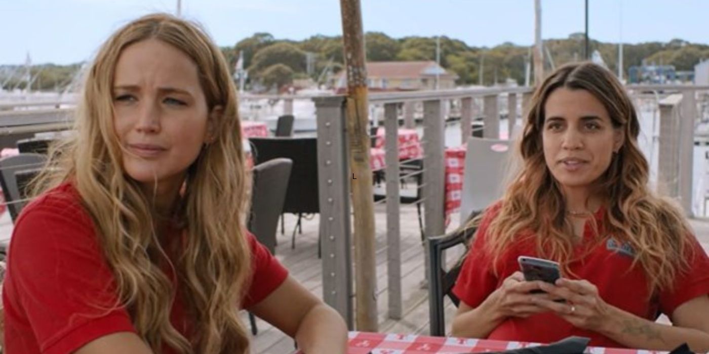 Jennifer Lawrence and Natalie Morales sitting and looking sideways in No Hard Feelings